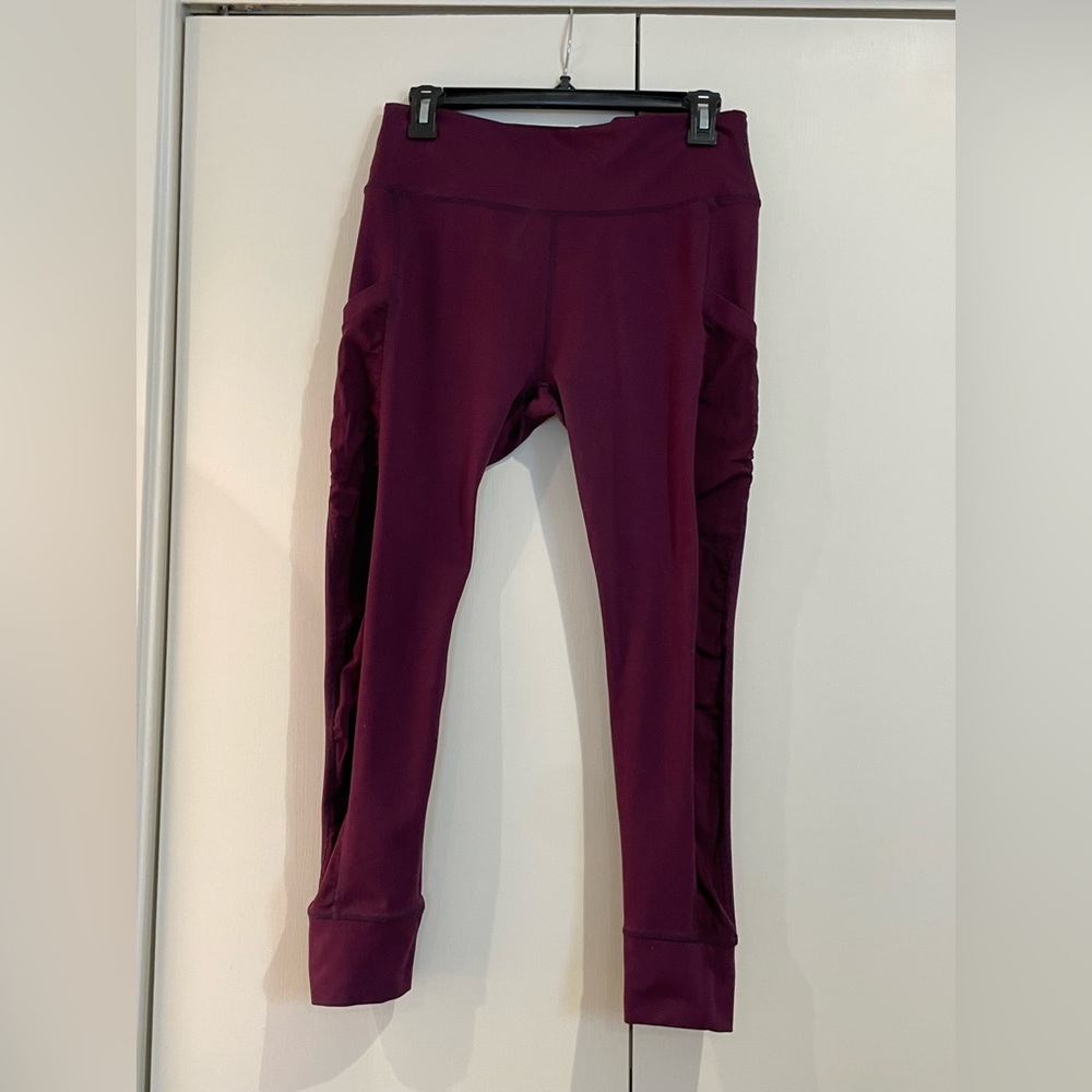 Fabletics medium wine colored, high wasted, workout leggings.
